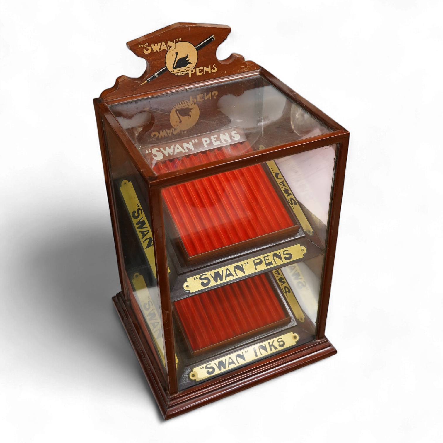 A rare complete Mabie Todd & Co. Swan pen cabinet with original signage and trays to hold twenty four pens, with key for lockable rear door